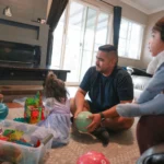 More dads taking paid family leave for a new baby, sometimes as much as moms are